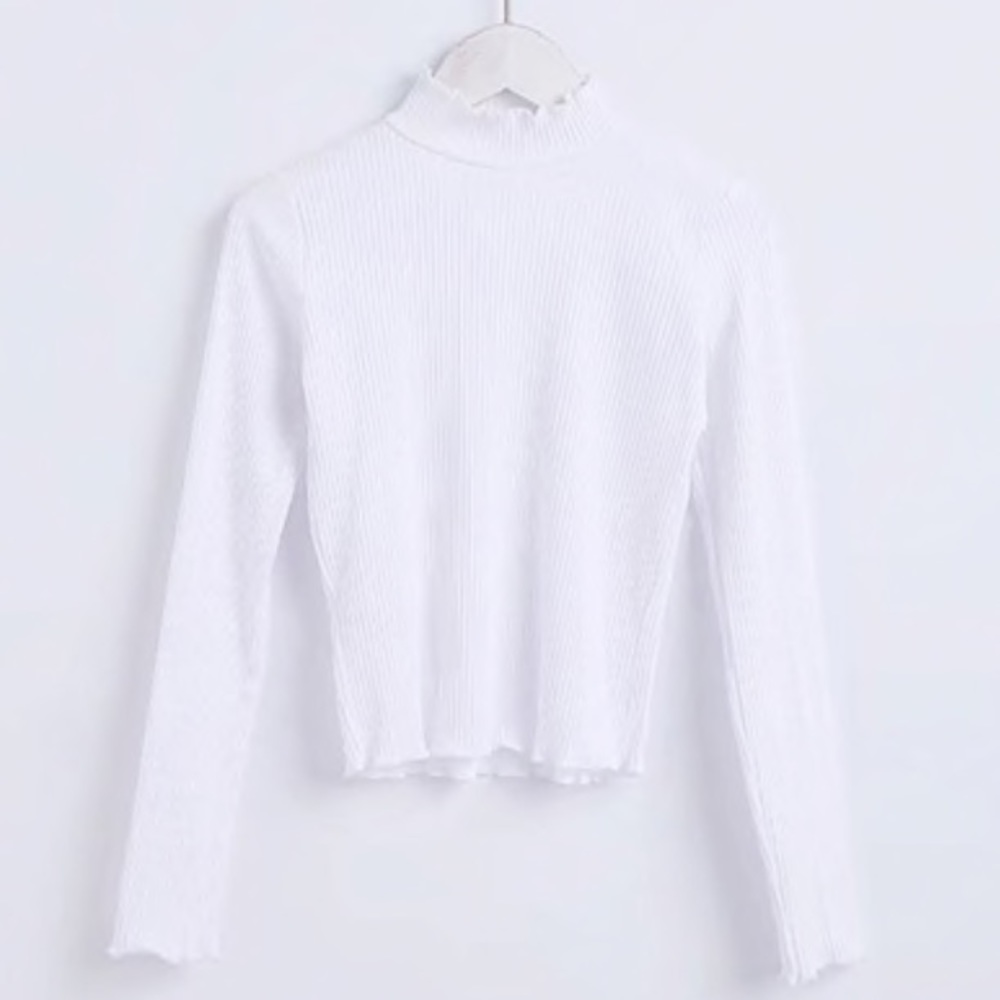 white ruffled sweater